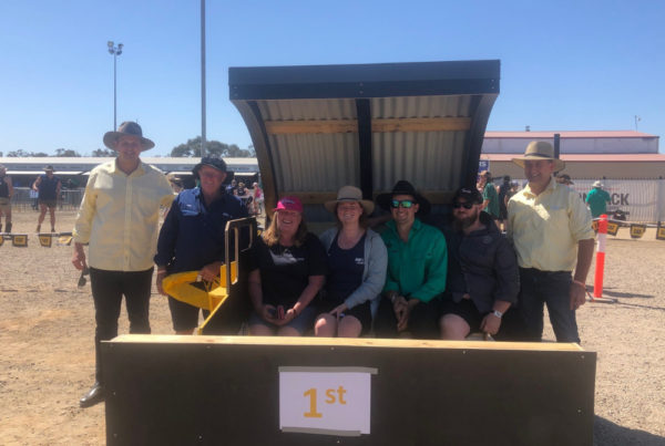Country Education Foundation of Edward River Region volunteers with Ray White Deniliquin auctioneers and the winning sand pit at the sand pit auction fundraiser for CEF Edward River at the 2023 Deni Ute Muster.